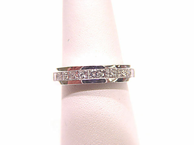 DIAMONDS ARE CHANNEL SET ALL THE WAY AROUND THE BAND