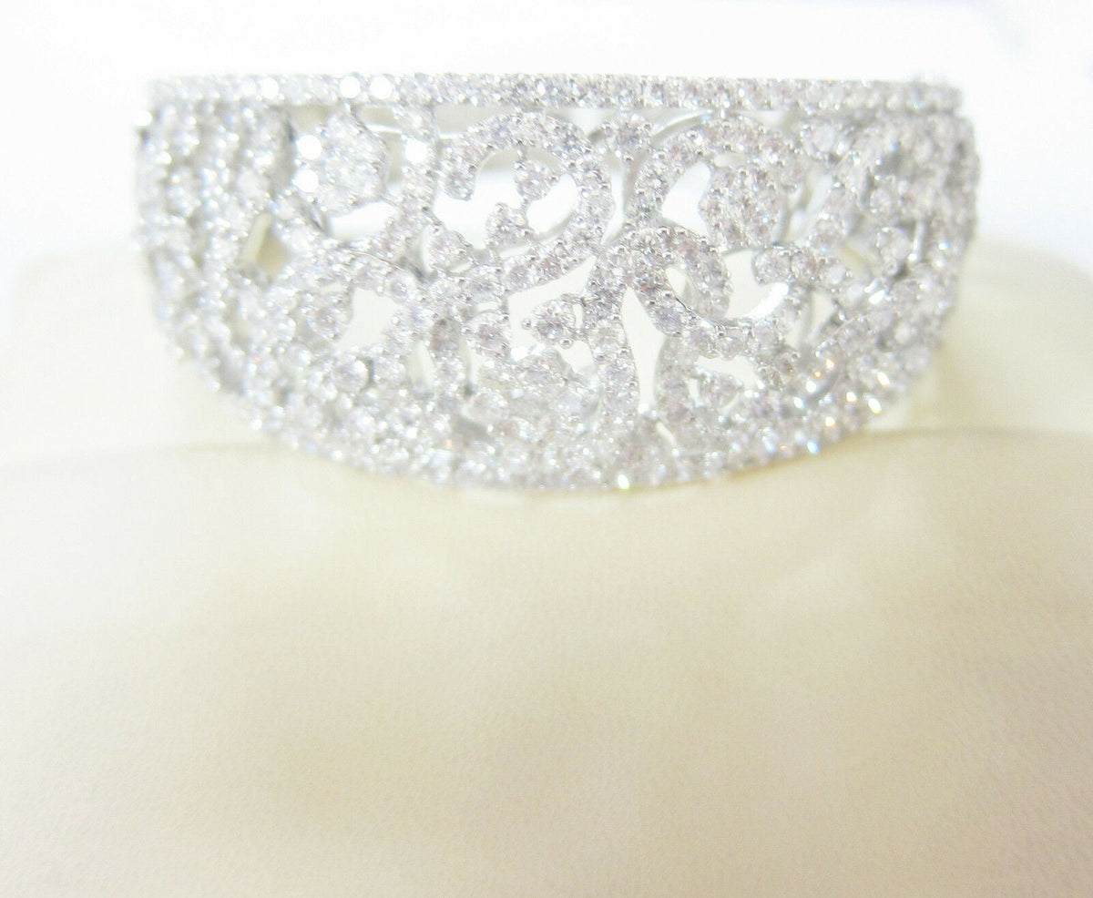 DIAMOND ROUND BRILLIANT FLOWER SWIRL BANGLE TOP GRADUATED TO BOTTOM