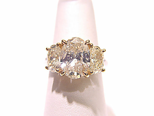 LABORATORY CERTIFIED FANCY LIGHT YELL PLAT GOLD D61.5% T60% GIRDLEMED TO THICK