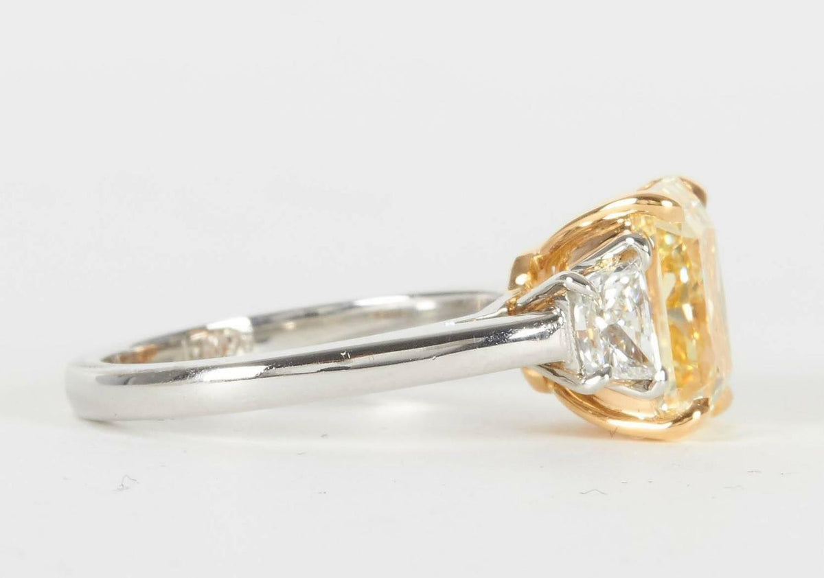 GIA FANCY LIGHT YELLOW 4.01 CT RADIANT VVS1 CLARITY GRADE .58 CT SIDE TRAPEZOID