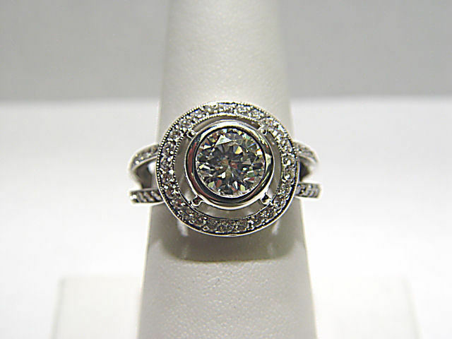 CERTIFIED DIAMOND ROUND BR 8.01X7.98X4.57MM BEZEL SET SIDE ROUND ENGAGEMENT RING