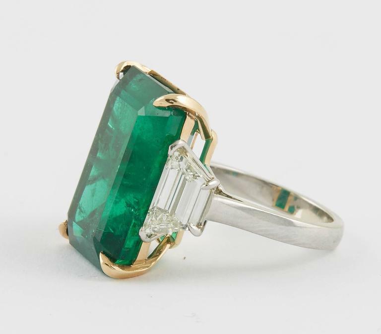 GIA certified 18.83 carat emerald set along 2.08 carat of side diamonds