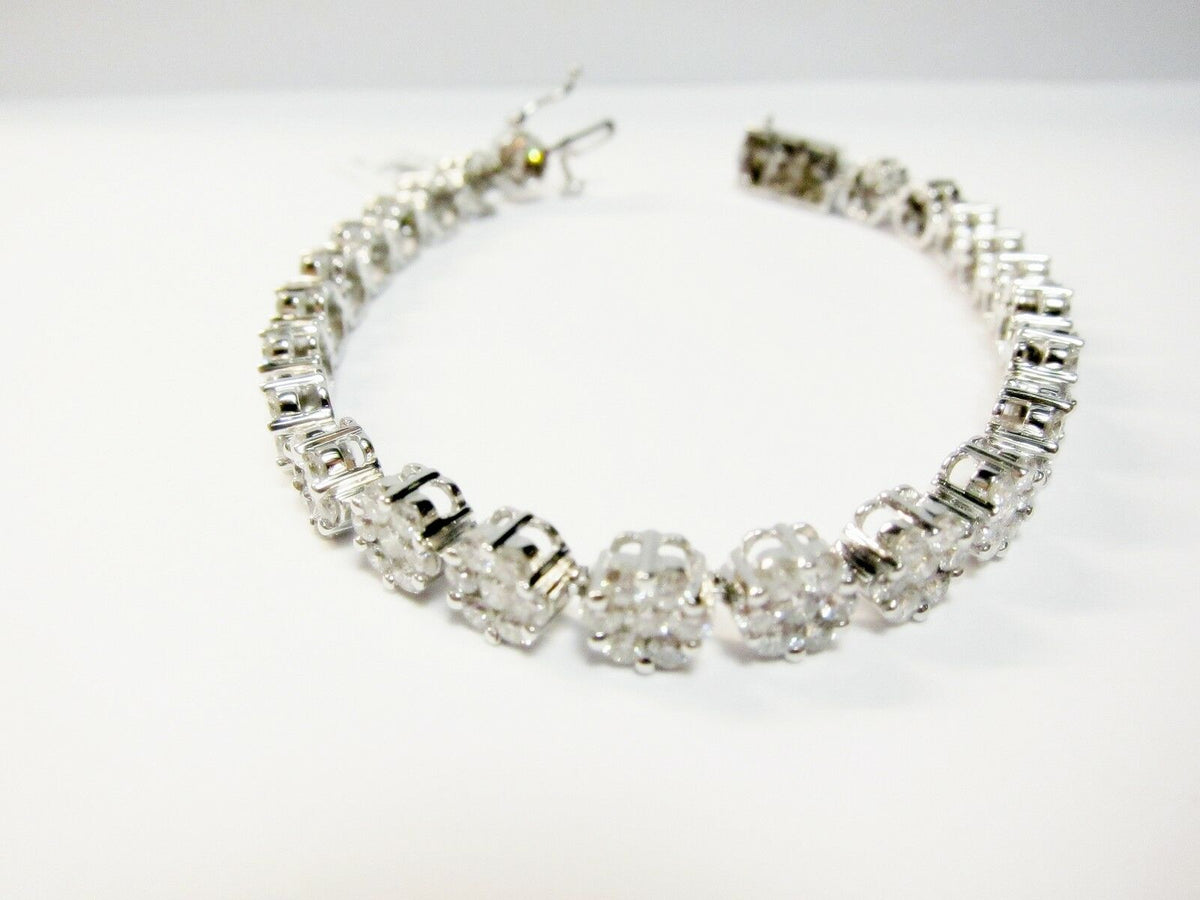 DIAMOND ROUND BRILLIANT CLUSTER SEVEN STONE SET EACH CLUSTER TENNIS BRACELET