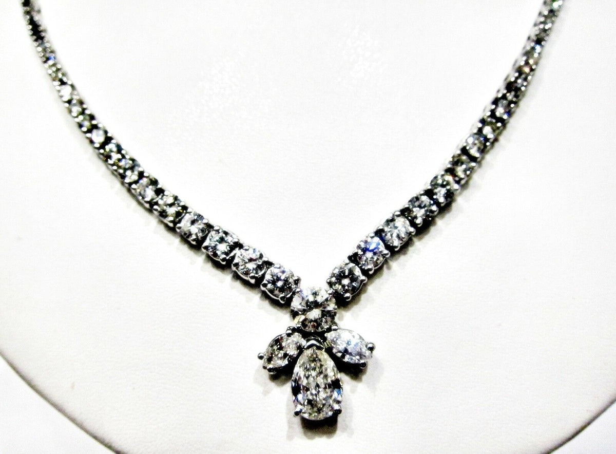 GIA CERTIFIED PEAR BRILLIANT SHAPE H SI1 SET WITH TWO