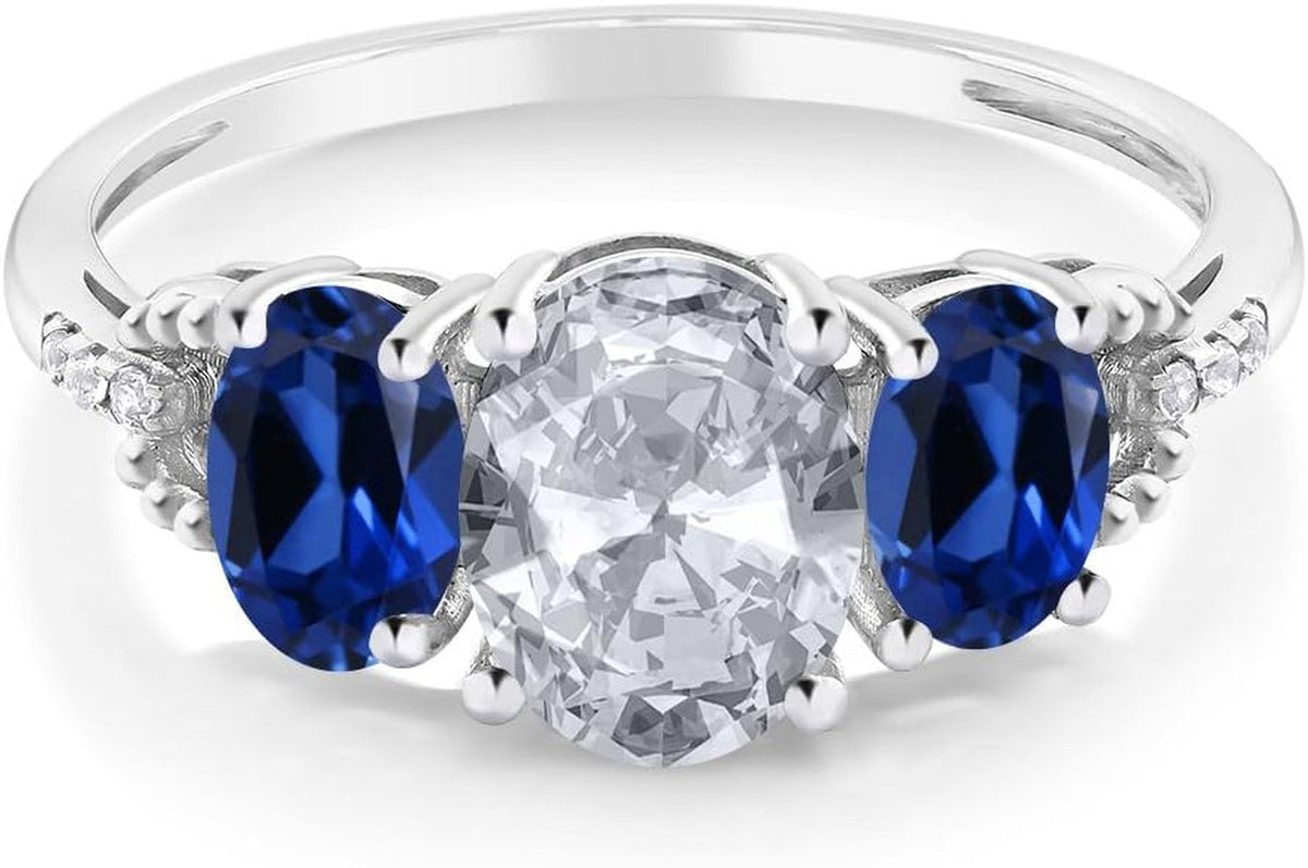 10K White Gold White Topaz Blue Created Sapphire and Diamond Accent 3-Stone Engagement Ring for Women (2.35 Cttw)