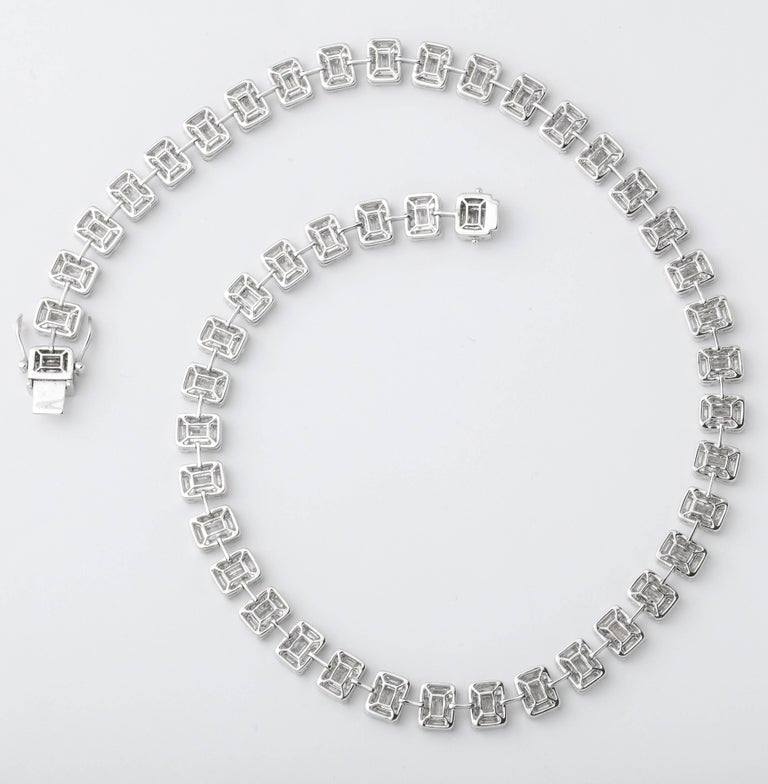 https://a.1stdibscdn.com/emerald-cut-diamond-necklace-illusion-set-for-sale-picture-3/j_415/j_99658421595349089120/6R1A3823_master.jpg?width=768