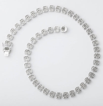 https://a.1stdibscdn.com/emerald-cut-diamond-necklace-illusion-set-for-sale-picture-3/j_415/j_99658421595349089120/6R1A3823_master.jpg?width=768