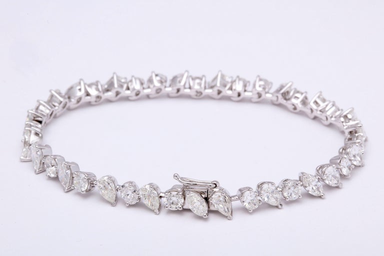 https://a.1stdibscdn.com/multi-shape-diamond-tennis-bracelet-for-sale-picture-3/0/j_57882221547578599576/6R1A3395_master.jpg?width=768