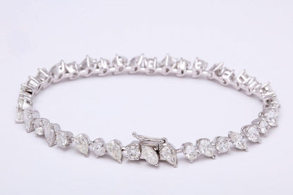https://a.1stdibscdn.com/multi-shape-diamond-tennis-bracelet-for-sale-picture-3/0/j_57882221547578599576/6R1A3395_master.jpg?width=768
