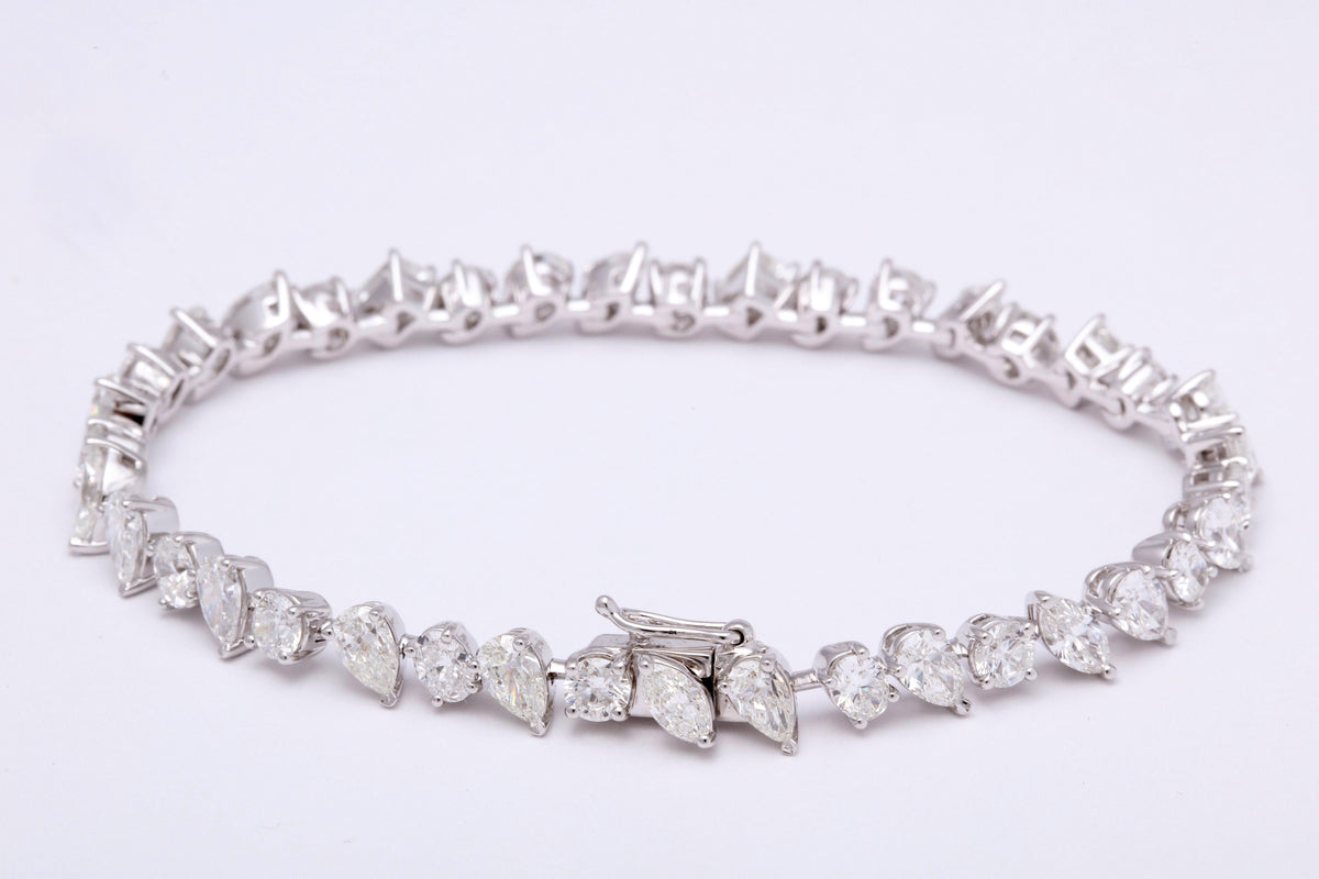 https://a.1stdibscdn.com/multi-shape-diamond-tennis-bracelet-for-sale-picture-3/0/j_57882221547578599576/6R1A3395_master.jpg