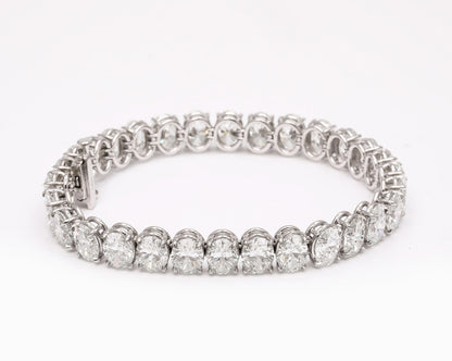 https://a.1stdibscdn.com/oval-diamond-tennis-bracelet-for-sale-picture-4/j_415/j_232203621718980089769/2P6A1413_master.jpg