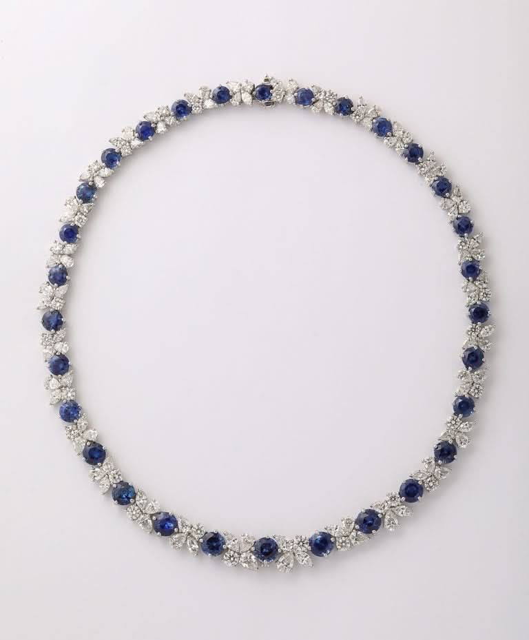 https://a.1stdibscdn.com/blue-sapphire-and-diamond-necklace-for-sale-picture-3/j_415/j_227289521714486587656/2P6A1548_master.jpg?width=768