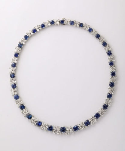 https://a.1stdibscdn.com/blue-sapphire-and-diamond-necklace-for-sale-picture-3/j_415/j_227289521714486587656/2P6A1548_master.jpg?width=768