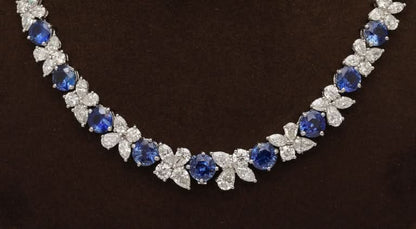 https://a.1stdibscdn.com/blue-sapphire-and-diamond-necklace-for-sale-picture-7/j_415/j_227289521714486587771/2P6A1552_master.jpg?width=768