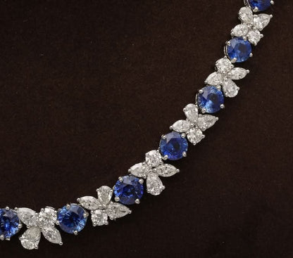 https://a.1stdibscdn.com/blue-sapphire-and-diamond-necklace-for-sale-picture-9/j_415/j_227289521714486592000/2P6A1554_master.jpg?width=768