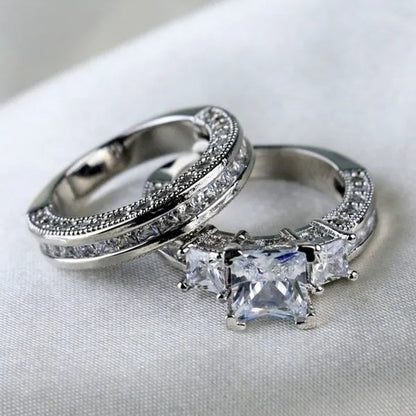YOHAPP NEW Fashion Couple Rings Set Jewelry - Men's 8mm 316L Stainless Steel Titanium Ring and Women's Three Stone Princess Cut 1CT Diamond   Silver  Bridal Wedding Engagement Band Ring