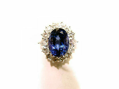 3.78 CT TANZANITE OVAL OVAL CUT SET WITH 12 ROUND BRILLIANT CUT DIAMONDS 18 K