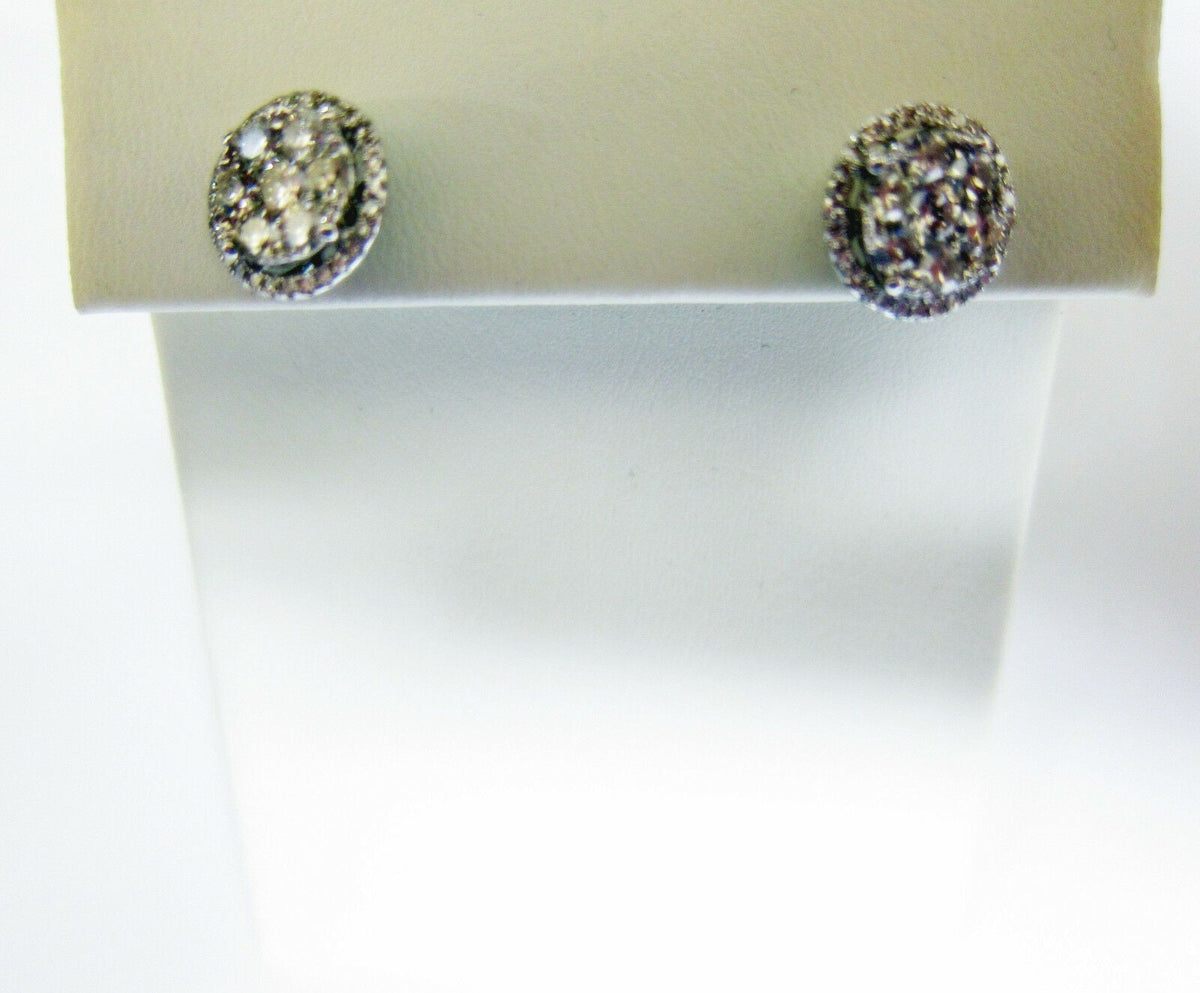 DIAMOND CENTER BIGGER THEN SMALLER THEN HALO STUD EARRING