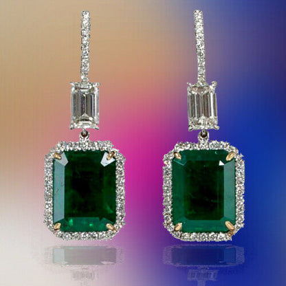 EMERALD 2 EMERALD SHAPE DIAMOND EMERALD SHAPE AND ROUND DROP HALO