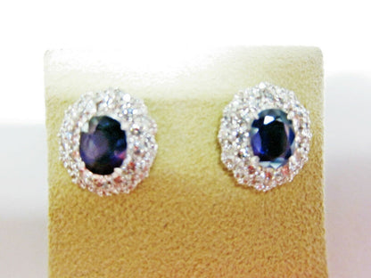 TWO SAPPHIRE OVAL SHAPE SET TWO ROW ROUND DIAMOND SET