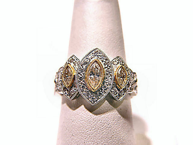 3 MARQUISE CUT DIAMONDS WITH ROUND BRILLIANT CUT DIAMONDS TOP SET RING PLATINUM