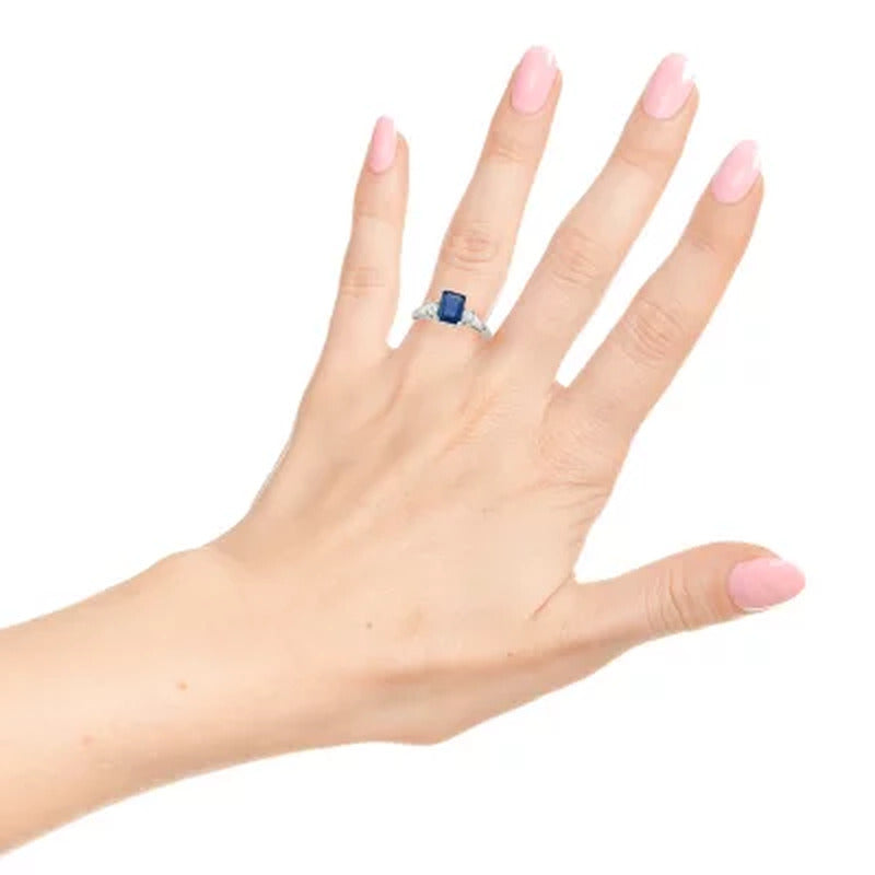 Three Stone Octogonal Sapphire Ring with .20CT. T.W. Diamond Set in 14K Gold