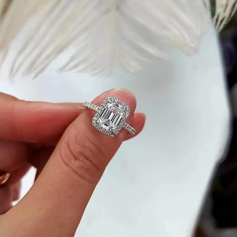 Emerald Cutter Proposes and Engages Moissanite Diamond Ring