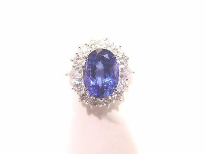 3.78 CT TANZANITE OVAL OVAL CUT SET WITH 12 ROUND BRILLIANT CUT DIAMONDS 18 K