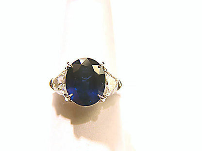 ONE OVAL BLUE SAPPHIRE SET WITH TWO HALF MOON DIAMONDS RING SAPPHIRE AND DIAMOND