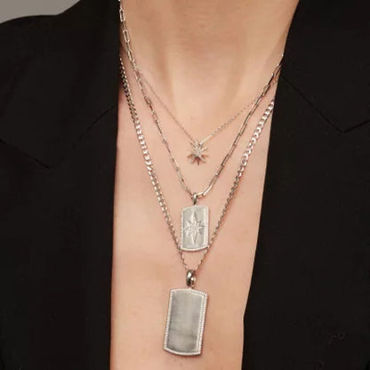 0.07 CT. T.W. Sterling Silver Diamond Starburst Pendant