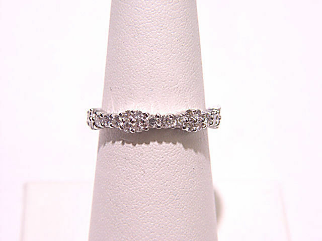 DIAMONDS PRONG SET ALL THE WAY AROUND ETERNITY