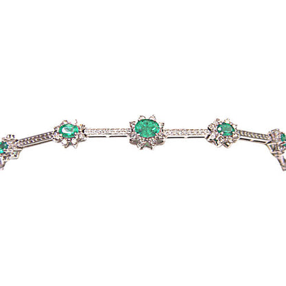 GRADUATED FROM CENTER 9 OVAL GREEN EMERALDS SET WITH ROUND BRILLIANT CUT DIAMOND