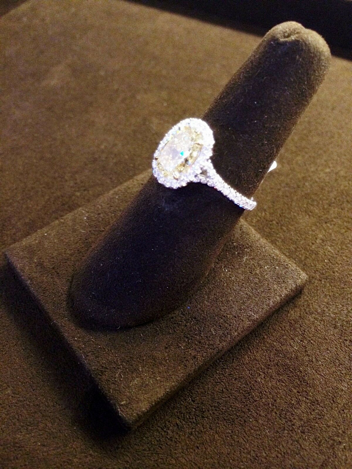 CERTIFIED OVAL FANCY LIGHT YELLOW DIAMOND HALO AND SIDE ROUND DIAMOND RING