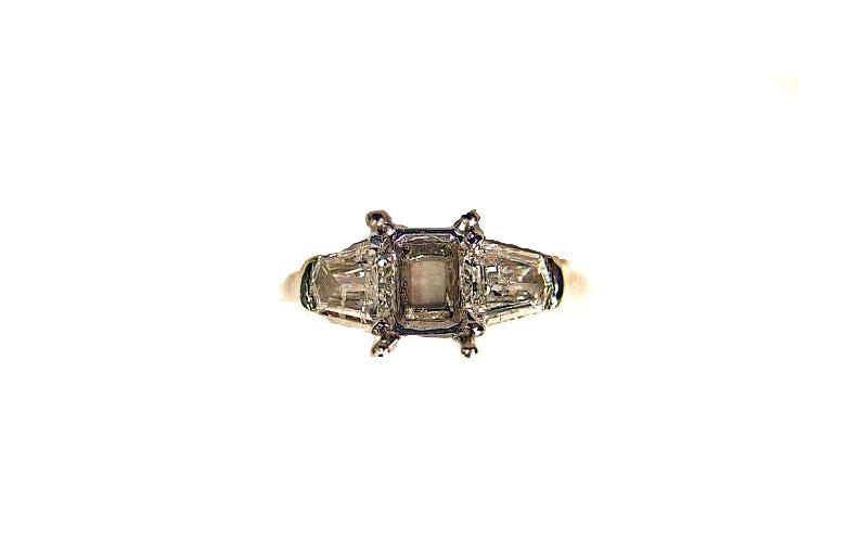 PLATINUM SETTING AND 2 NATURAL SHEILD CUT DIAMOND