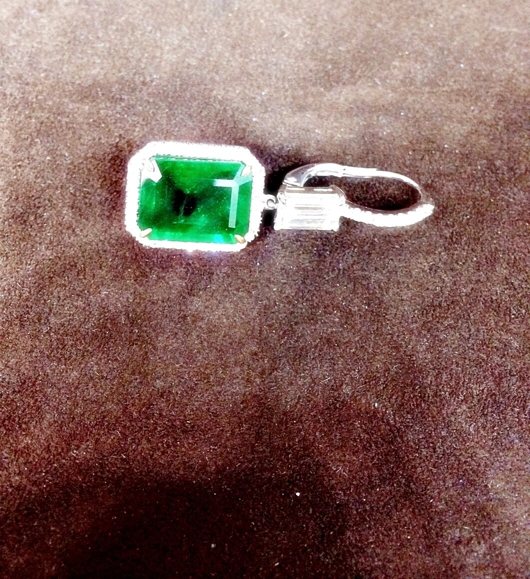 EMERALD 2 EMERALD SHAPE DIAMOND EMERALD SHAPE AND ROUND DROP HALO