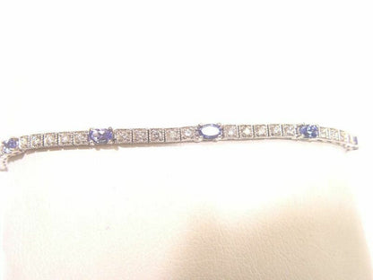 8 OVAL SHAPE TANZANITE 2.05CT WITH 40 ROUND BRILLIANT SH DIAMOND BOX SET 1.34 CT