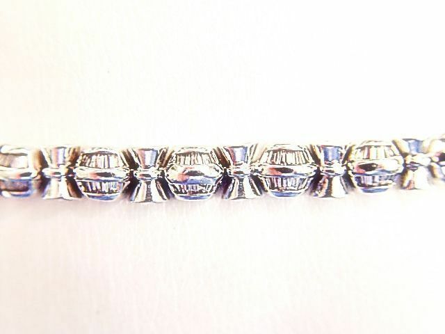 BAGUETTE SHAPE DIAMOND CHANNEL SET WITH GOLD BARS IN-BETWEEN DIAMOND