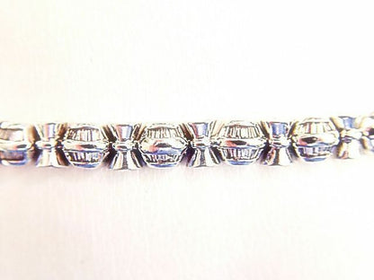 BAGUETTE SHAPE DIAMOND CHANNEL SET WITH GOLD BARS IN-BETWEEN DIAMOND