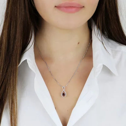 Dancing Garnet and 0.12 CT. T.W. Diamond Infinity Pendant in Sterling Silver