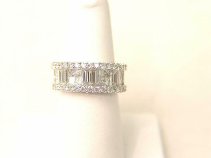 34 ROUND BRILLIANT CUT PRONG SET 16 PRINCESS CUT AND 6 BAGUETTE CUT INVISIBLE