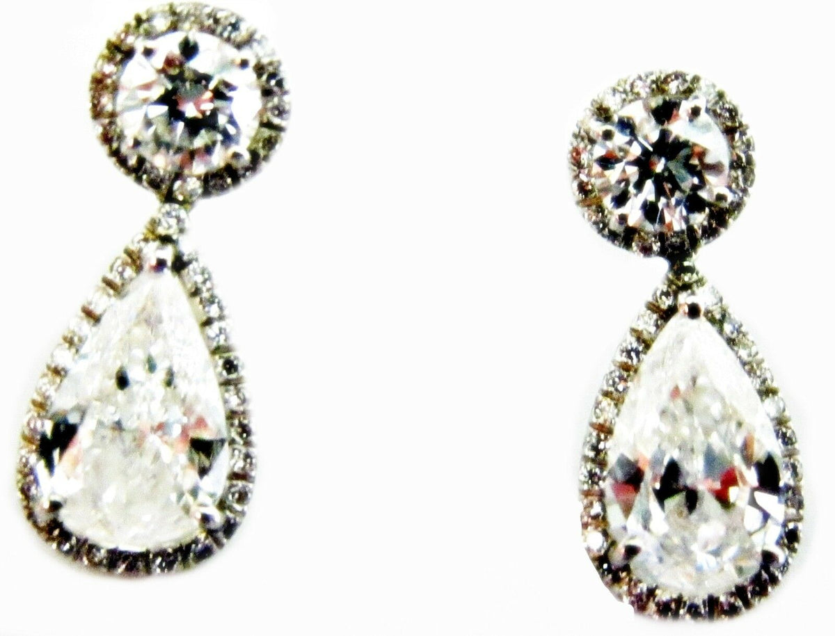 GIA CERTIFIED PEAR SHAPE 1.56CT F SI1, GIA 1.52CT F SI1 AND SET ROUND DIAMOND