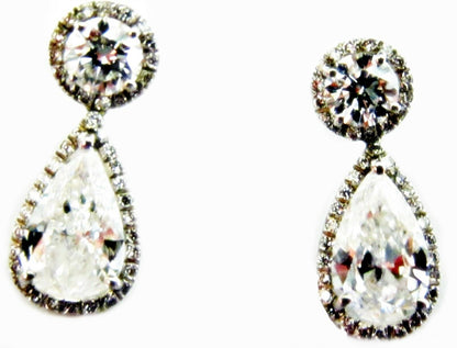 GIA CERTIFIED PEAR SHAPE 1.56CT F SI1, GIA 1.52CT F SI1 AND SET ROUND DIAMOND
