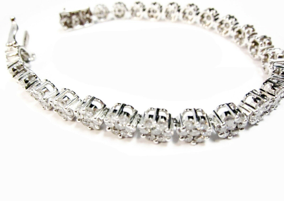 DIAMOND ROUND BRILLIANT CLUSTER SEVEN STONE SET EACH CLUSTER TENNIS BRACELET