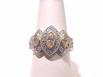 3 MARQUISE CUT DIAMONDS WITH ROUND BRILLIANT CUT DIAMONDS TOP SET RING PLATINUM