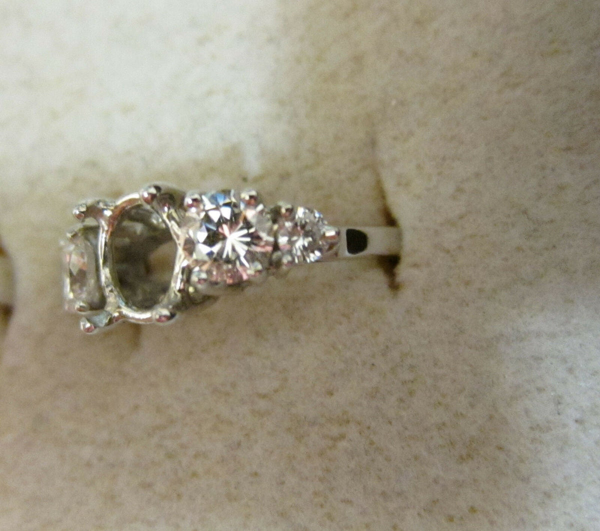 Diamond setting and two and two round brilliant shape diamond engagement setting