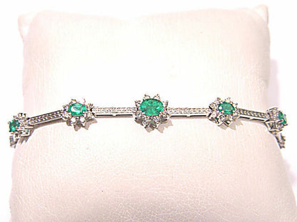 GRADUATED FROM CENTER 9 OVAL GREEN EMERALDS SET WITH ROUND BRILLIANT CUT DIAMOND