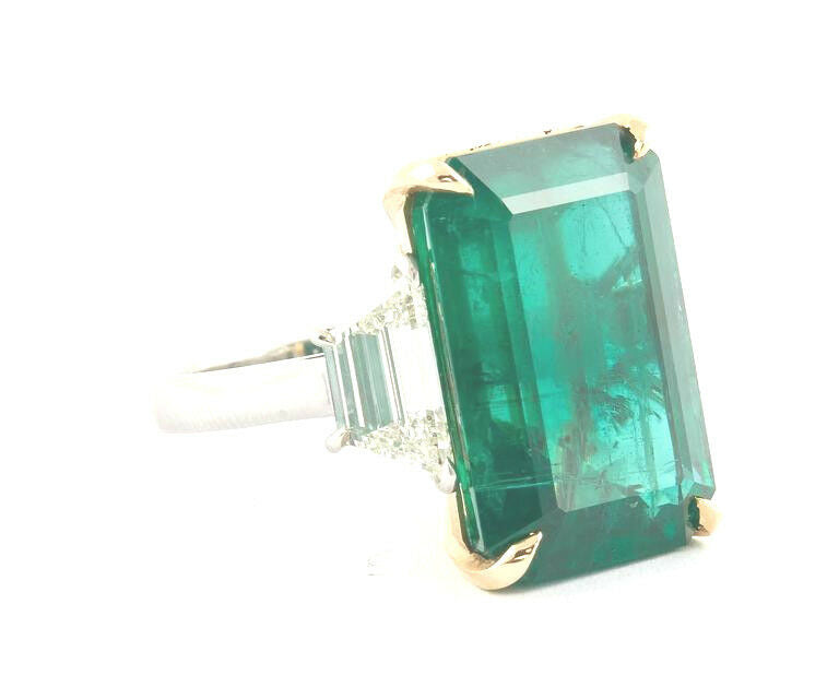 GIA certified 18.83 carat emerald set along 2.08 carat of side diamonds