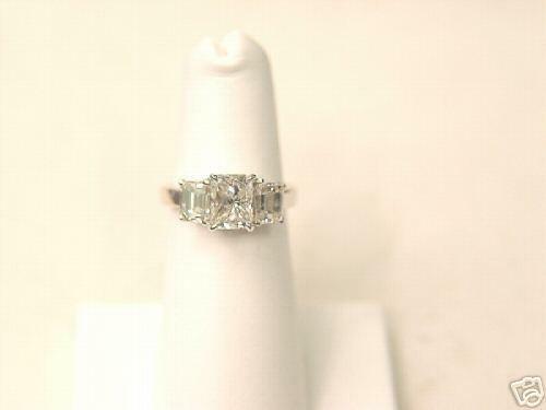 RADIANT CUT DIAMOND CENTER 4 PRONG SET 1.50 CT SIDES 2 SET
