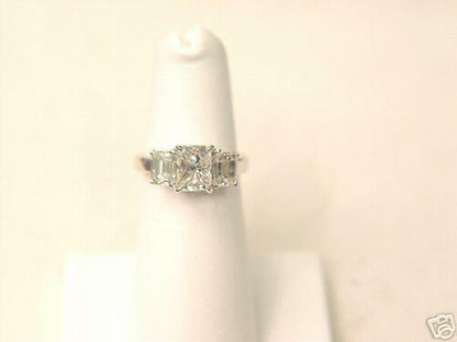 RADIANT CUT DIAMOND CENTER 4 PRONG SET 1.50 CT SIDES 2 SET