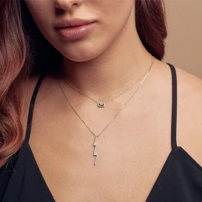 London Blue Topaz and .06 CT. T.W. Diamond Baguette Pendant Necklace in 14K Gold